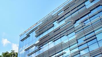 Urban abstract - windowed wall of office building. Detail shot of modern business building in city. photo