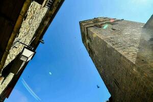 the view of old stone buildings from the ground up photo