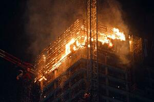 Warsaw, Poland. 7 June 2019. A fire at the Warsaw Hub construction site. Fire in a high-rise building. photo