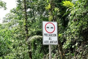 a sign that says precaucion al adelantar photo