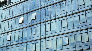 Urban abstract - windowed wall of office building. Detail shot of modern business building in city. photo