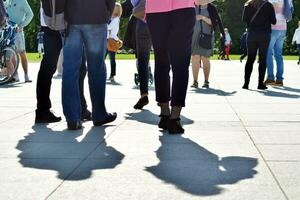 People walking on big city street, blurred motion crossing abstract photo