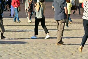 People walking on big city street, blurred motion crossing abstract photo