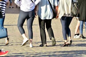 People walking on big city street, blurred motion crossing abstract photo