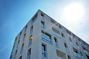 Modern apartment building in sunny day. Exterior, residential house facade. photo