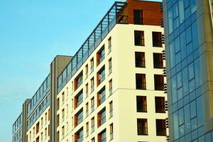 Modern apartment building in sunny day. Exterior, residential house facade photo