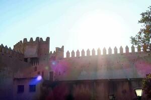 the sun shines brightly through the walls of an old castle photo