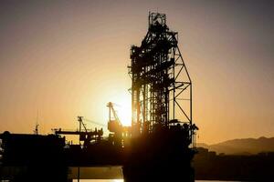 oil rig at sunset photo