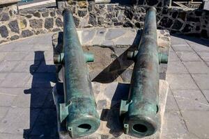 two cannons on a stone platform photo