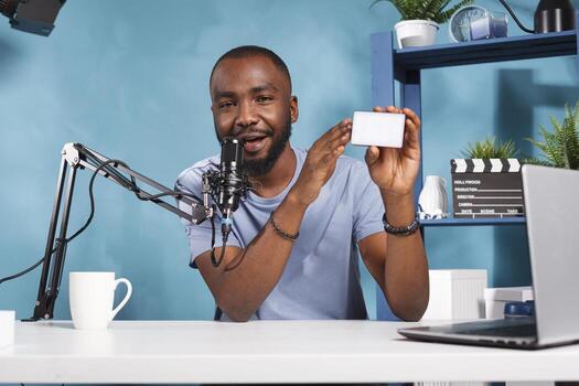 Influencer recommending photography lighting tool to internet blog subscribers while live streaming. Vlogger testing and reviewing videography professional equipment while recording video photo