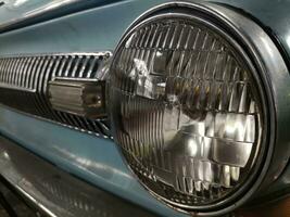 Old retro car headlight close view photo, automobile background photo