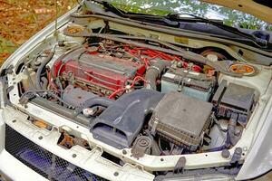 Car engine with opened hood. Car service conceptual photo