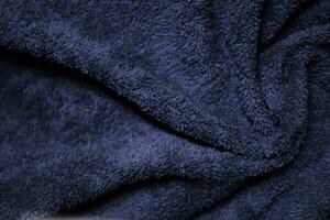Dark blue velvet fabric texture used as background. Sky color panne fabric background of soft and smooth textile material. crushed velvet .luxury cobalt tone for silk. photo