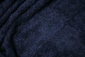 Dark blue velvet fabric texture used as background. Sky color panne fabric background of soft and smooth textile material. crushed velvet .luxury cobalt tone for silk. photo