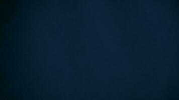 blue velvet  soft rough textile material background texture close up,poker table,tennis ball,table cloth. Empty navy blue fabric denim background. photo