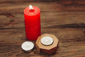 Multicolored candles, paraffin, wax and aromatic on a wooden table. photo