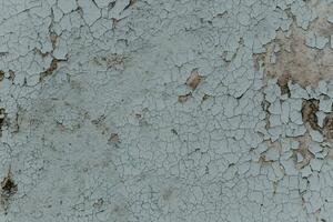 Gray texture of old cracked paint, grunge background. photo