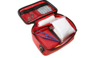 Emergency First Aid Kit, Medical Emergency Supplies for Health Care and Safety, Isolated for Rescue and Treatment Support photo