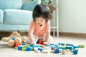 Happy Asia children play and learn toy blocks.family is happy and excited in the house. daughter having fun spending time, Activity, development, IQ, EQ, meditation, brain, muscles, essential skills. photo