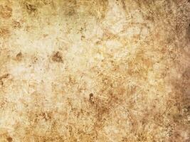 Close-up view of an old antique drumhead surface. Natural leather texture background from musical instrument. photo