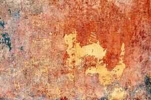 Texture of a concrete wall with cracks and scratches which can be used as a background photo