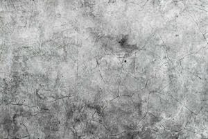 Aged cracked concrete stone plaster wall background and texture photo