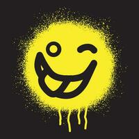 Smiley emoticon stencil graffiti stuck out tongue with yellow spray paint on black background vector