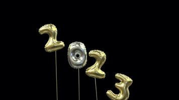 colored new year mylar balloon writing 2023 with the 3 flying away and 4 floating up to form 2024 video