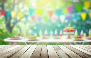 Empty wooden table with party on blurred garden background photo