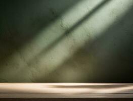 Table empty against background of dark green plaster wall. composition featuring light reflections photo