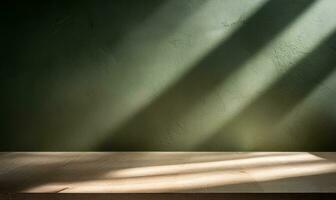 Table empty against background of dark green plaster wall. composition featuring light reflections photo