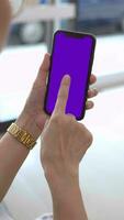 Hand holding mobile phone, smartphone in hand, closeup of hand holding phone video