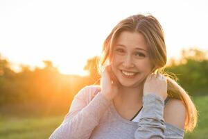 beautiful portrait of carefree friendly approachable girl with a stunning smile and cute looks photo