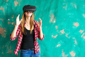 Smile happy woman getting experience using VR-headset glasses of virtual reality much gesticulating hands photo