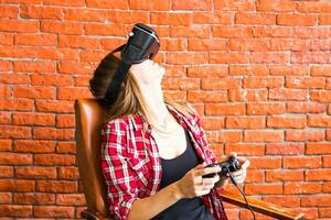 Smile happy woman getting experience using VR-headset glasses of virtual reality much gesticulating hands photo