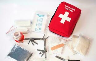 Emergency First Aid Kit, Medical Emergency Supplies for Health Care and Safety, Isolated for Rescue and Treatment Support photo