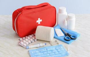 Emergency First Aid Kit, Medical Emergency Supplies for Health Care and Safety, Isolated for Rescue and Treatment Support photo