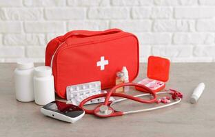 Emergency First Aid Kit, Medical Emergency Supplies for Health Care and Safety, Isolated for Rescue and Treatment Support photo