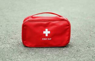 Emergency First Aid Kit, Medical Emergency Supplies for Health Care and Safety, Isolated for Rescue and Treatment Support photo