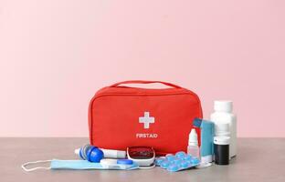 Emergency First Aid Kit, Medical Emergency Supplies for Health Care and Safety, Isolated for Rescue and Treatment Support photo