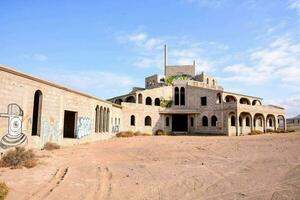 the abandoned building is covered in graffiti photo