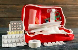 Emergency First Aid Kit, Medical Emergency Supplies for Health Care and Safety, Concept for Rescue and Treatment Support photo