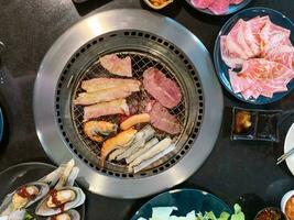 Top view set of beef and pork ready for grill on stove serve Korean style barbecue photo