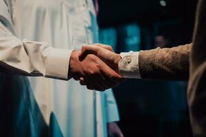 Middle eastern man shaking hands in an office photo