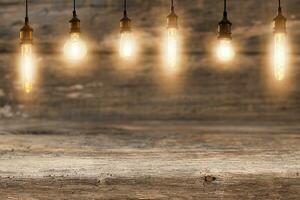 Electric light bulbs over a wooden background photo