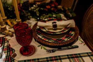 set christmas table with plates and glasses photo