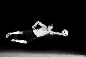 Man playing soccer photo