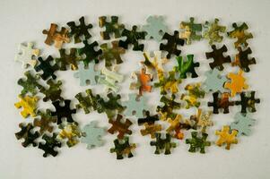 a pile of puzzle pieces photo