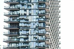 a tall building with many windows and balconies photo