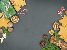 Christmas background with gift boxes, gingerbread cookies and spices photo